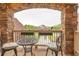 Charming stone balcony with wrought iron furniture and neighborhood views at 401 Sara Ct, Loganville, GA 30052