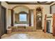 Luxurious bathroom with a vaulted tile ceiling, jacuzzi tub, and a walk-in shower at 401 Sara Ct, Loganville, GA 30052
