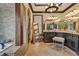Elegant bathroom boasts double vanities, a walk-in shower, and tile flooring at 401 Sara Ct, Loganville, GA 30052