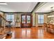 Elegant foyer with hardwood floors, a staircase, and double front doors at 401 Sara Ct, Loganville, GA 30052