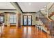 Stunning foyer boasts hardwood floors, staircase, and beautiful trim at 401 Sara Ct, Loganville, GA 30052