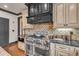 Gourmet kitchen featuring custom cabinets, stainless steel appliances, and granite countertops at 401 Sara Ct, Loganville, GA 30052