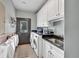 Well-organized laundry room with ample counter space, sink, washer, dryer, and convenient storage solutions at 401 Sara Ct, Loganville, GA 30052