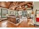 Spacious living room with exposed beams, hardwood floors, comfortable seating and plenty of light at 401 Sara Ct, Loganville, GA 30052
