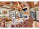 Inviting living room with a stone fireplace, exposed beams, hardwood floors, and ample seating at 401 Sara Ct, Loganville, GA 30052