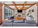 Living room features a stone fireplace, built-in shelving, hardwood floors, and natural light at 401 Sara Ct, Loganville, GA 30052