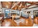 Well-lit main bedroom flows to a living room area and boasts exposed wood beams at 401 Sara Ct, Loganville, GA 30052