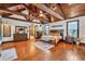 Spacious main bedroom boasts vaulted ceilings, exposed wood beams, and hardwood floors at 401 Sara Ct, Loganville, GA 30052