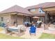 Spacious outdoor patio with seating, fire pit, and covered area for entertaining at 401 Sara Ct, Loganville, GA 30052