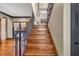 Elegant staircase with hardwood treads and decorative wrought iron banister at 401 Sara Ct, Loganville, GA 30052