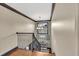 Stairway with wooden steps, wrought iron railing, and decorative lighting fixture, leading upstairs at 401 Sara Ct, Loganville, GA 30052