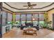 Relaxing sunroom featuring tile floors, comfortable seating, lots of windows and natural light at 401 Sara Ct, Loganville, GA 30052