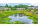 Aerial view of pond surrounded by townhomes at 6304 Brookwater Vw, Mableton, GA 30126