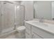 Clean bathroom featuring tiled shower with glass doors and a white vanity with a single sink at 6304 Brookwater Vw, Mableton, GA 30126