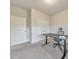 Neutral bedroom with gray walls, carpet, black desk, chair, and adjacent double closet at 6304 Brookwater Vw, Mableton, GA 30126