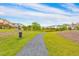 Gravel walking path adjacent to grassy area and adjacent townhomes at 6304 Brookwater Vw, Mableton, GA 30126