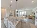 Open kitchen design with stainless appliances, granite countertops, a center island, and seamless flow to living area at 6304 Brookwater Vw, Mableton, GA 30126