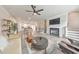 Bright, open-concept living space with modern decor, fireplace, and seamless flow to the kitchen and dining areas at 6304 Brookwater Vw, Mableton, GA 30126