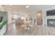 Inviting open-concept living space featuring a kitchen, dining area, and cozy living room with fireplace at 6304 Brookwater Vw, Mableton, GA 30126
