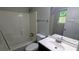Bathroom featuring a shower-tub combo, toilet, and sink with vanity at 685 Greenhedge Dr, Stone Mountain, GA 30088
