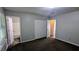 Bedroom showing plush carpeting, closet, and access to ensuite bathroom at 685 Greenhedge Dr, Stone Mountain, GA 30088