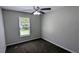 Bedroom featuring plush carpet, a ceiling fan, and a bright window at 685 Greenhedge Dr, Stone Mountain, GA 30088