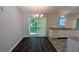 Open dining area with modern lighting and sliding glass doors to the backyard at 685 Greenhedge Dr, Stone Mountain, GA 30088