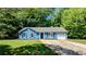Charming blue home with a well-manicured lawn and a single-car garage at 685 Greenhedge Dr, Stone Mountain, GA 30088