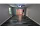 Living room showcasing stylish hardwood floors, modern paint, and an open layout, offering seamless flow into adjacent spaces at 685 Greenhedge Dr, Stone Mountain, GA 30088