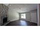 Bright living room with dark wood floors, a stone fireplace, and natural light at 685 Greenhedge Dr, Stone Mountain, GA 30088