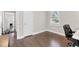 Bedroom featuring hardwood floors and a large window at 1659 Beecher Sw St, Atlanta, GA 30310