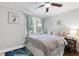 Comfortable bedroom with ceiling fan, window, and neutral decor at 1659 Beecher Sw St, Atlanta, GA 30310