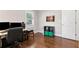 Bedroom featuring hardwood floors, office setup and lots of natural light at 1659 Beecher Sw St, Atlanta, GA 30310
