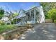 Charming home with a well-manicured lawn and a driveway leading to a detached garage, nestled in a serene setting at 1659 Beecher Sw St, Atlanta, GA 30310
