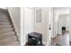 Hallway with hardwood staircase and view into living space at 1659 Beecher Sw St, Atlanta, GA 30310