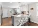 Well-lit kitchen featuring an eat-in bar with marble countertops, stainless appliances, and hardwood flooring at 1659 Beecher Sw St, Atlanta, GA 30310