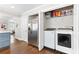 A kitchen with a laundry closet including stainless fridge, washer and dryer at 1659 Beecher Sw St, Atlanta, GA 30310