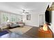 Bright living room with hardwood floors, plantation shutters, comfortable seating, and ample natural light at 1659 Beecher Sw St, Atlanta, GA 30310