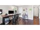 Office with hardwood floors, desk, shelving and natural light at 1659 Beecher Sw St, Atlanta, GA 30310