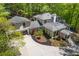Aerial view of a large home featuring mature landscaping and a circular driveway at 4067 Randall Farm Se Rd, Atlanta, GA 30339