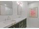 Bathroom featuring a double sink vanity with marble countertops and modern fixtures at 4067 Randall Farm Se Rd, Atlanta, GA 30339