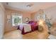 Cozy bedroom with hardwood floors, natural light, and charming decor at 4067 Randall Farm Se Rd, Atlanta, GA 30339
