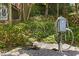 Electric vehicle charger station surrounded by lush landscaping near the home at 4067 Randall Farm Se Rd, Atlanta, GA 30339