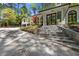Elegant home entrance with stone steps, front door, and manicured landscaping at 4067 Randall Farm Se Rd, Atlanta, GA 30339
