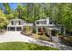 Stunning home exterior with manicured lawn, driveway, and attached garage at 4067 Randall Farm Se Rd, Atlanta, GA 30339