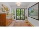 Entryway featuring hardwood floors, stylish decor, and a glass panel front door at 4067 Randall Farm Se Rd, Atlanta, GA 30339