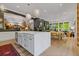 Open-concept kitchen with a large island, stainless appliances, and hardwood floors at 4067 Randall Farm Se Rd, Atlanta, GA 30339