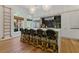 Well-lit gourmet kitchen with white cabinets, stone counters, and island seating at 4067 Randall Farm Se Rd, Atlanta, GA 30339