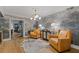 Elegant living room with scenic wallpaper, modern lighting and hardwood floors at 4067 Randall Farm Se Rd, Atlanta, GA 30339