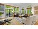 Bright living room with hardwood floors, large windows, and stylish decor, perfect for entertaining at 4067 Randall Farm Se Rd, Atlanta, GA 30339